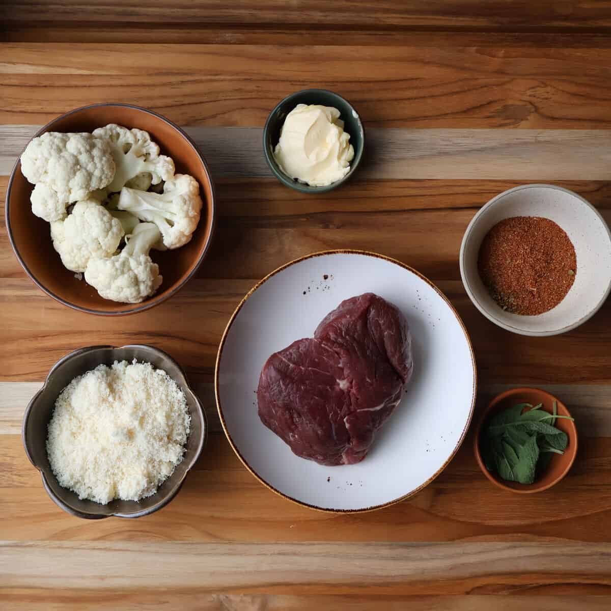 ingredients for blackened filet mignon laid out on a cutting board