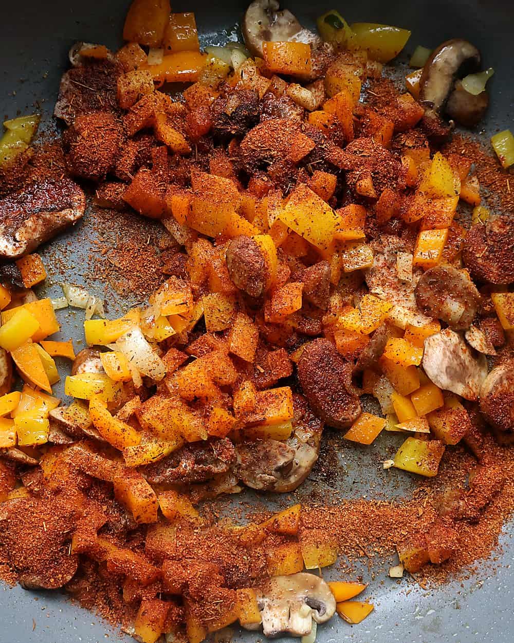Cajun seasoning blooming in the hot pan