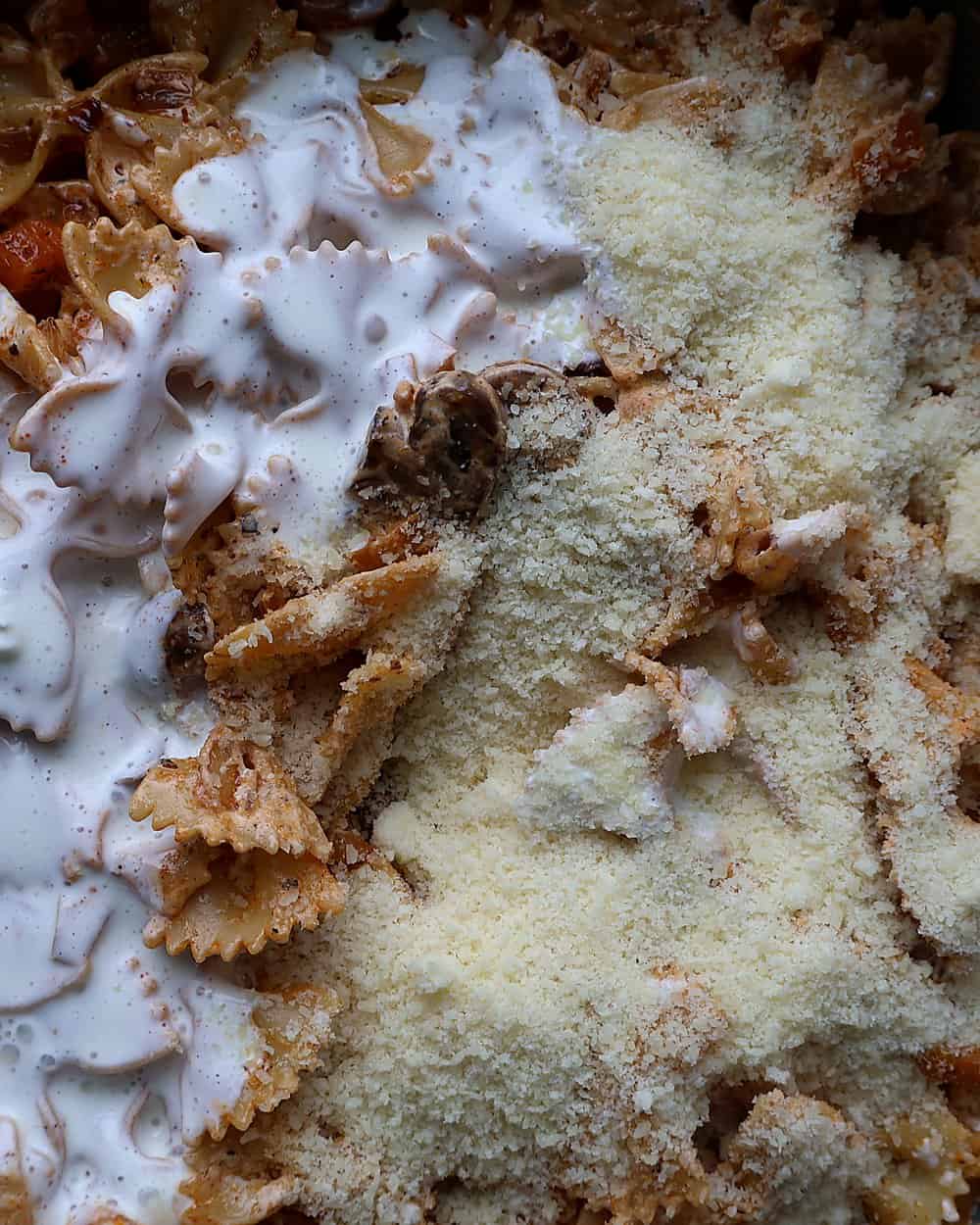 Smooth glossy cottage cheese sauce being tossed with pasta