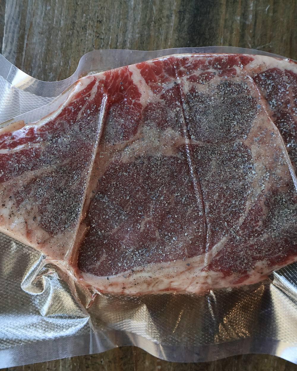 Step 2 - Vacuum-sealed seasoned ribeye ready for the sous vide bath