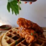 Spicy chicken and waffles with maple syrup and chives — featured image