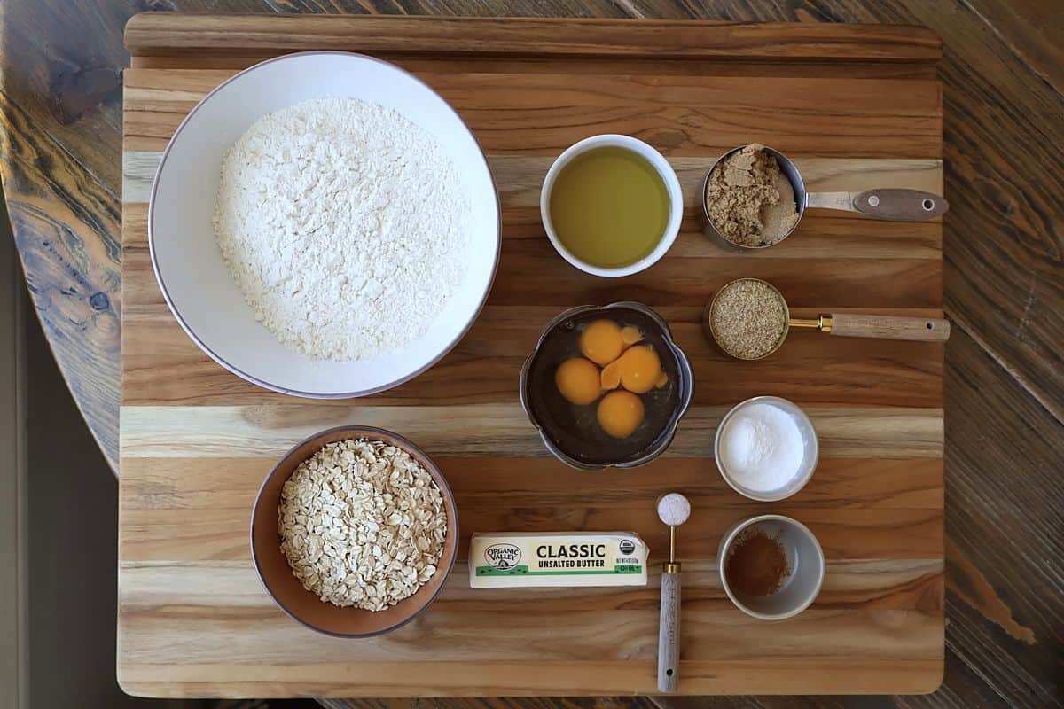 Whole wheat waffle ingredients flat lay on a wooden board