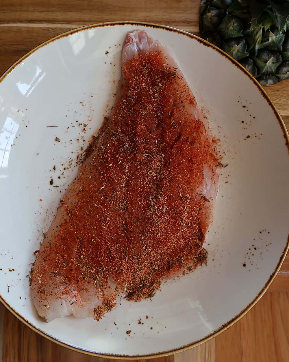 White fish fillet coated in homemade blackening seasoning