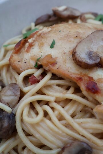 Chicken marsala pasta with mascarpone cream sauce in a bowl