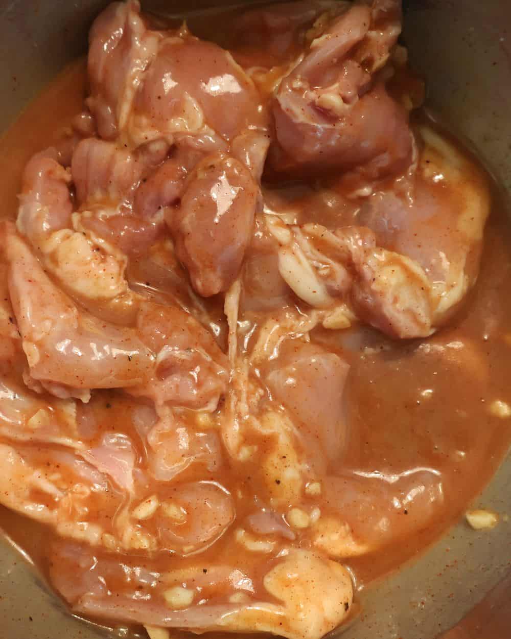 Chicken thighs marinating in Dijon garlic honey marinade